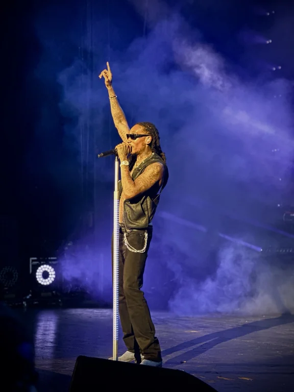 Taylor Gang performance under blue stage lighting