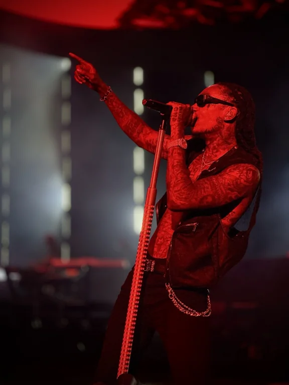 Taylor Gang performance under red stage lighting